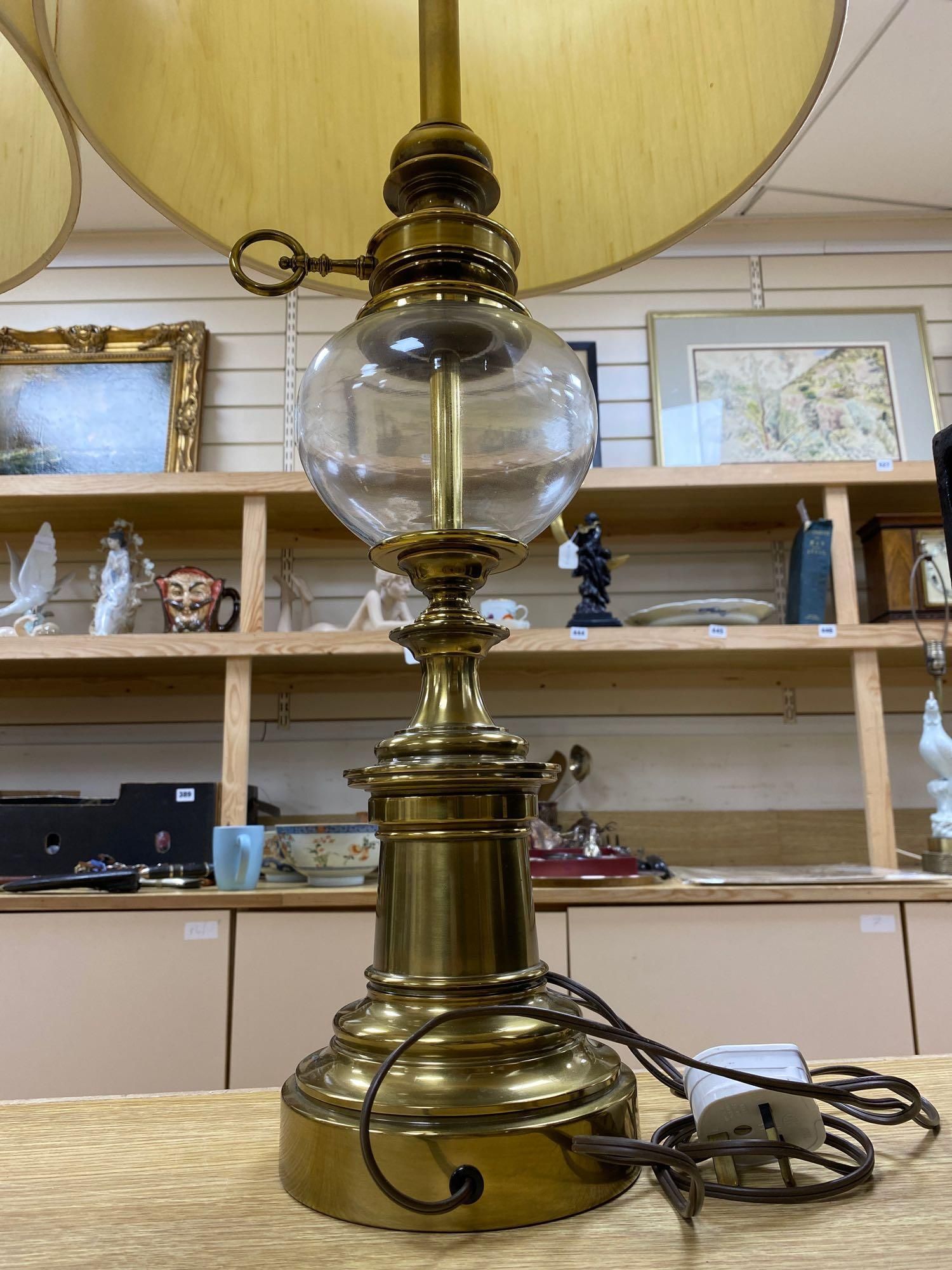 A pair of Art Nouveau style brass lamps, total height 67cm